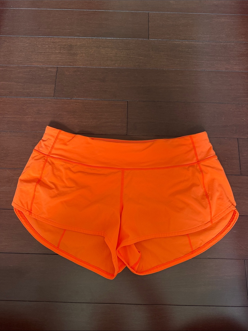 lululemon neon Orange women’s Athletic shorts size 8 2” inseam